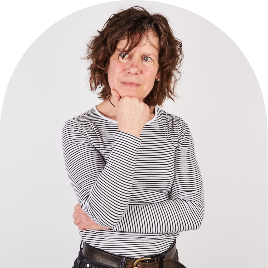 Older woman in striped t-shirt holding hand on chin, thinking. Portrait.