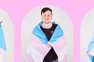 A pink banner has three arch shaped images of diverse gender, sexuality, age and race trans people